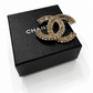 CHANEL CLASSIC CC CRYSTAL BROOCH IN GOLD TONE