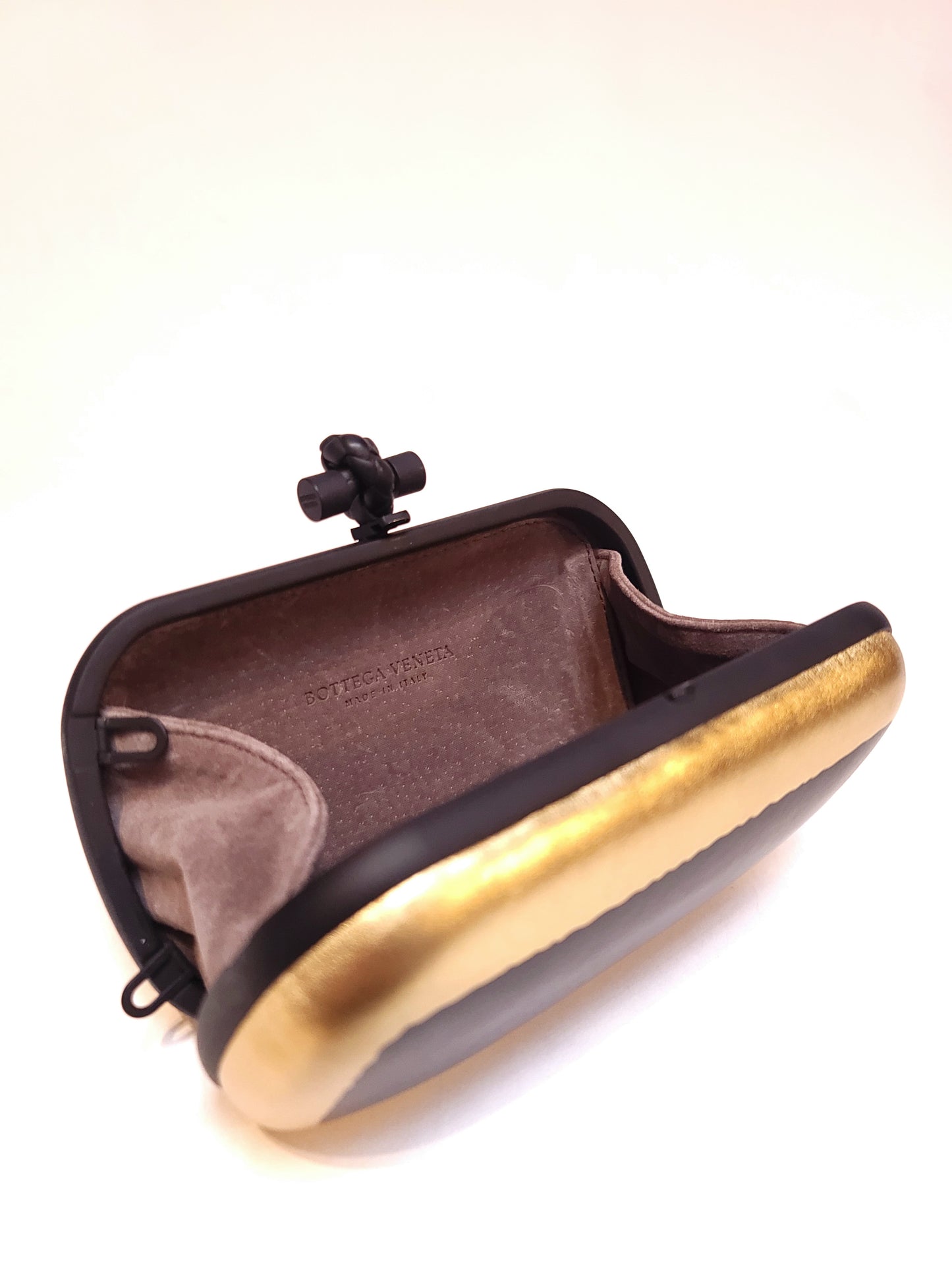 Bottega Veneta Gilded Waxed Leather Knot Clutch Gold Black
