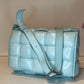 BOTTEGA VENETA PALE BLUE PADDED CASSETTE BAG