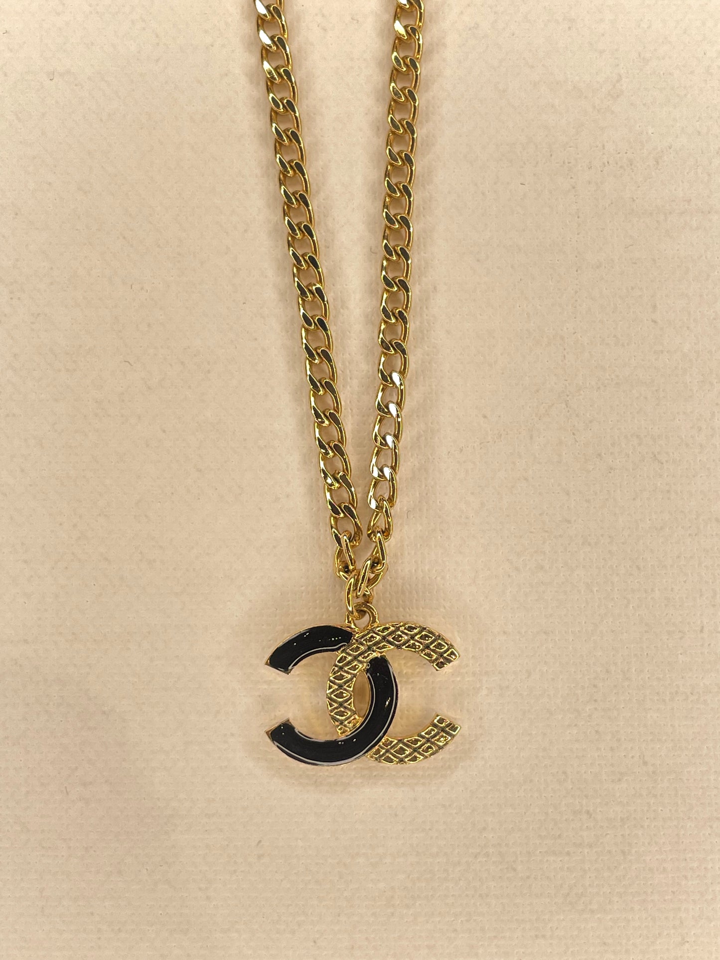 CHANEL GOLD AND BLACK LOGO NECKLACE